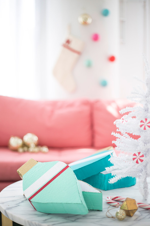 Cardboard ornament and white Christmas tree