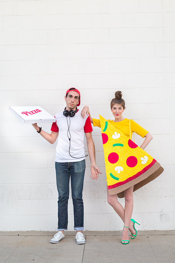 A woman dressed as pizza and a man dressed as a delivery man 