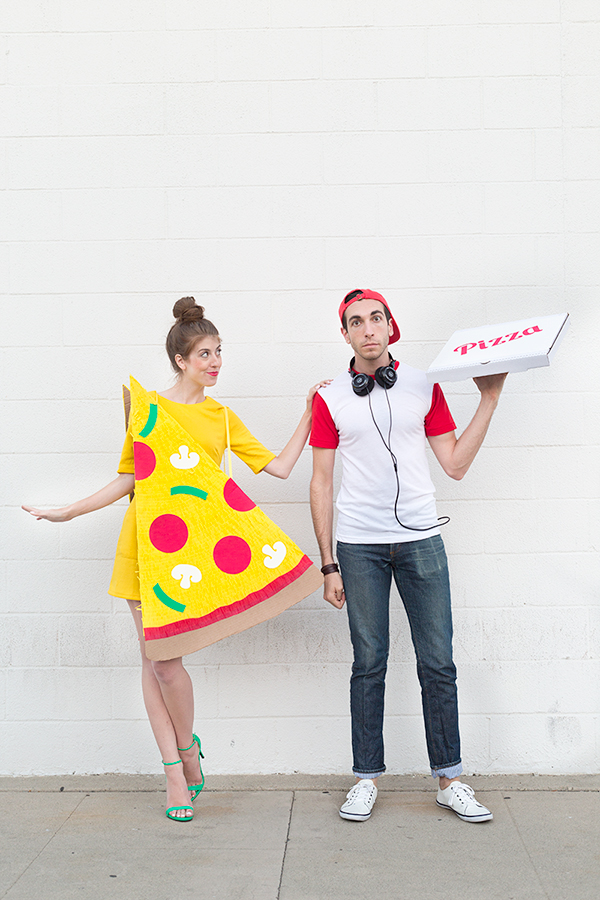 A woman dressed as pizza and a man dressed as a delivery man 
