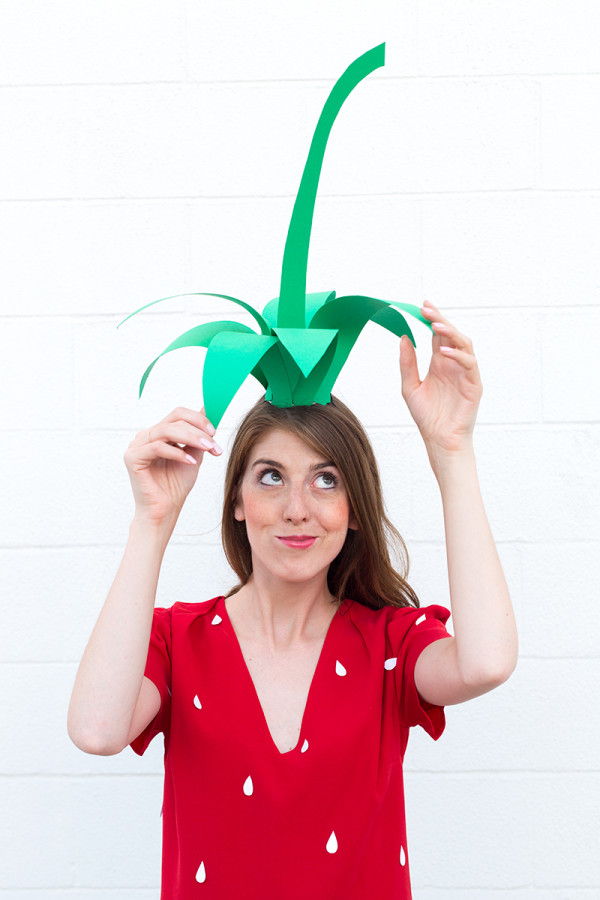 A woman in a strawberry costume 