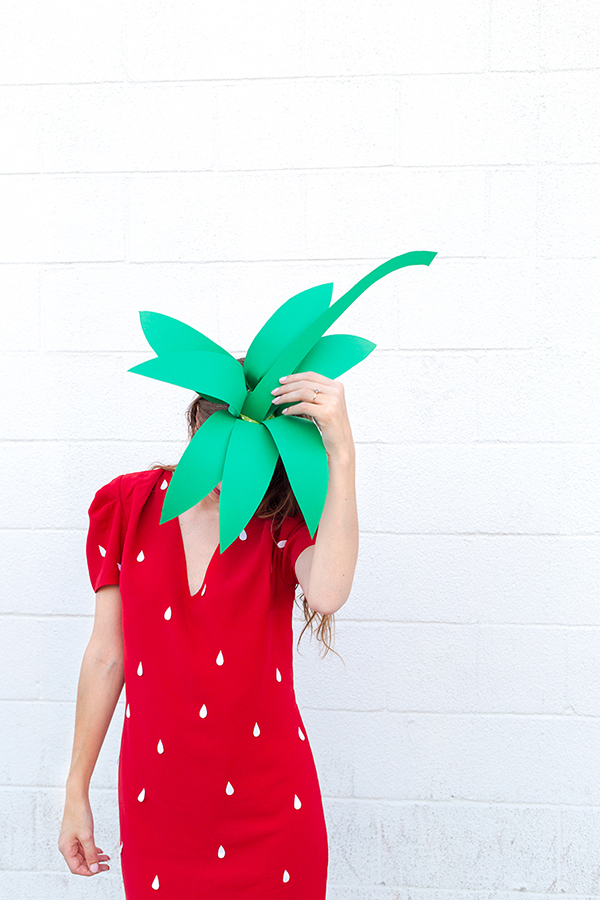 A woman in a strawberry costume 