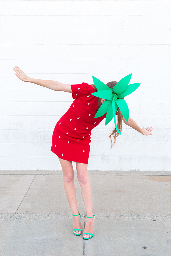 A woman in a strawberry costume 