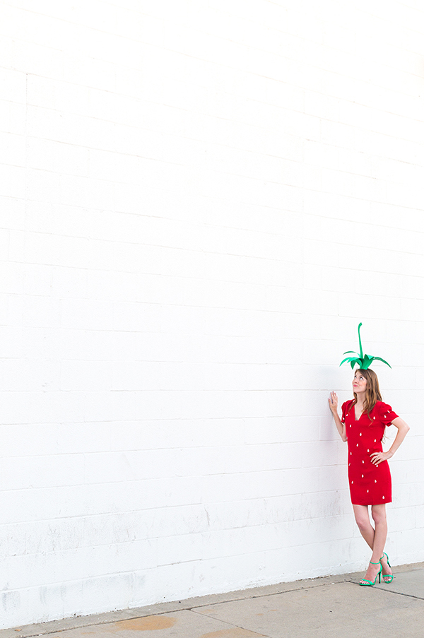 A woman in a strawberry costume 