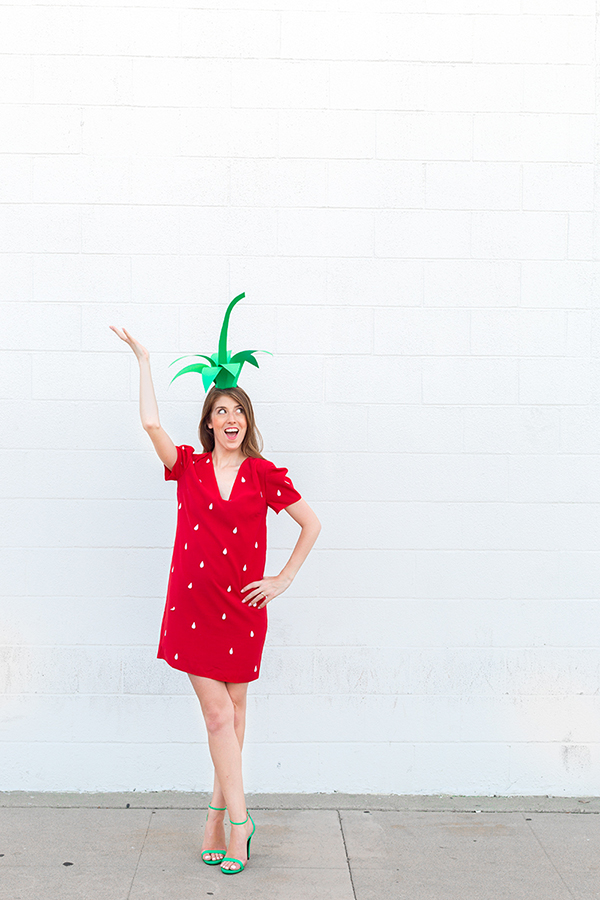 A woman in a strawberry costume 