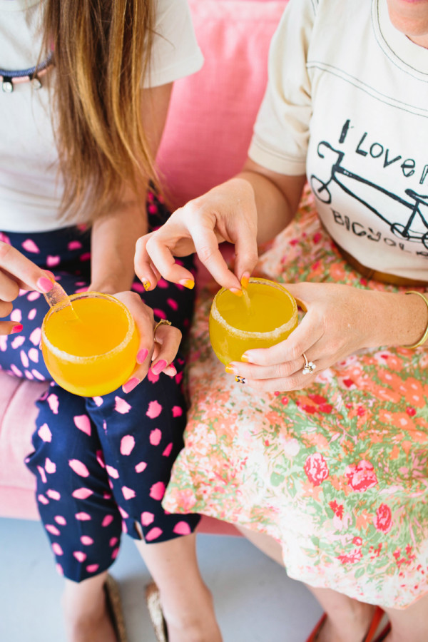 Women drinking an orange drink
