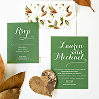 Green wedding invitations and leaves  