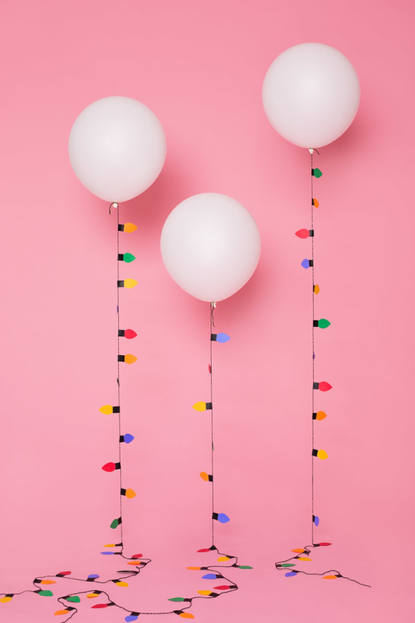 Paper Christmas lights attached to balloons 