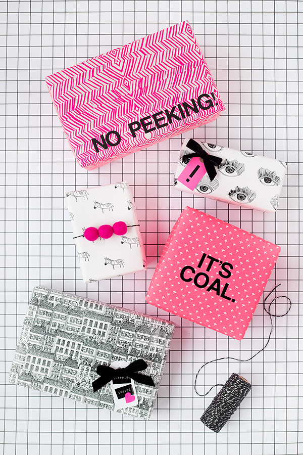 A pink box that says \"no peeking\" and other presents 