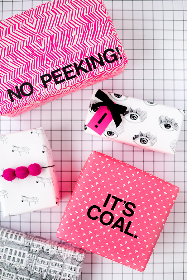 Presents in pink, black, and white wrapping paper 