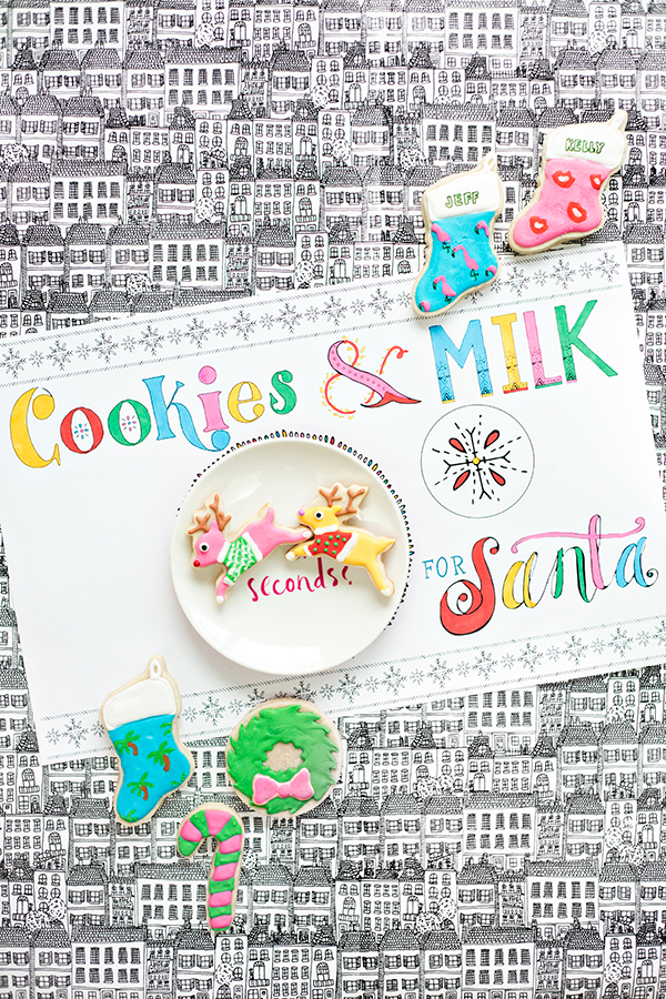 A place mat that says \"cookies and milk\" with bowls on it