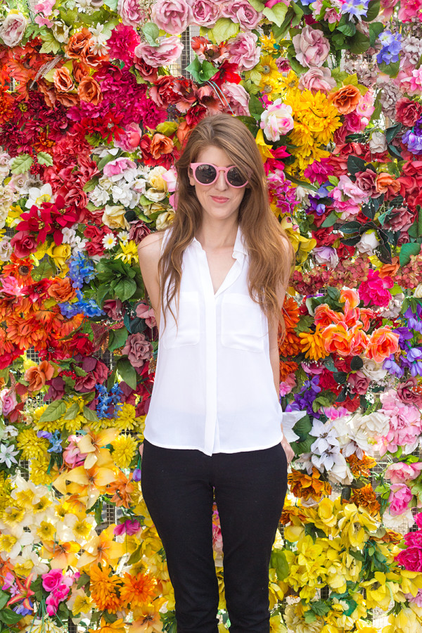 A woman in white blouse and black pants