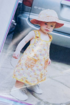 A photo of a little girl in a dress