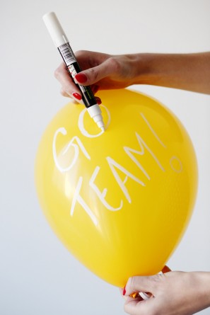 Yellow balloon with white words on it