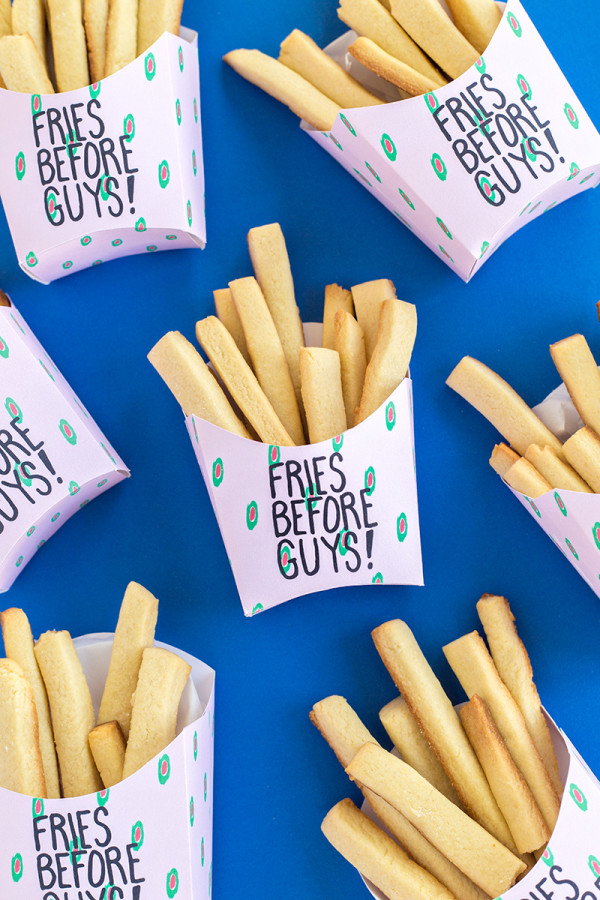 Fake fries that say \"fries before guys\"