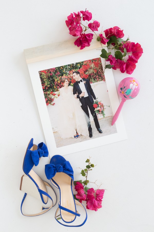 A photo with flowers and heels next to it