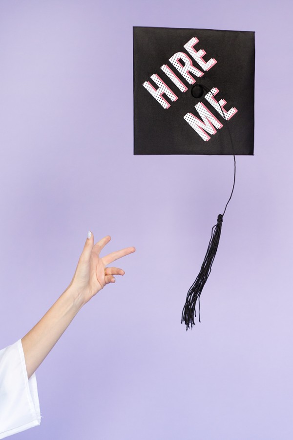 Someone throwing a graduation cap in the air