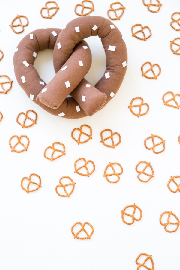 Pretzel pillow with pretzels next to it