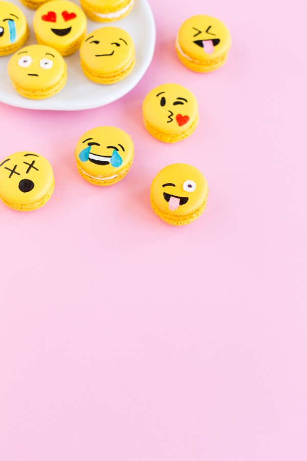 Emoji macarons on a pink background