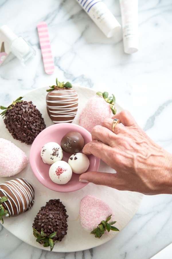 Someone grabbing a dessert from a bowl