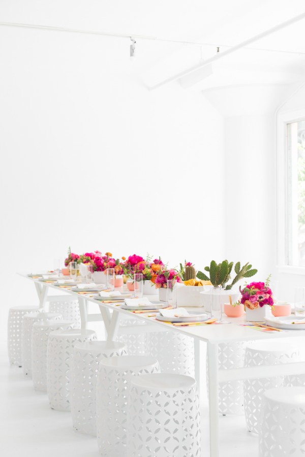 A table set with flowers and plants