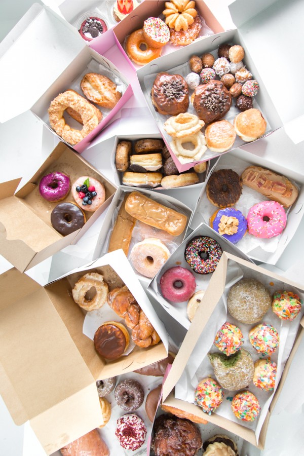 A bunch of boxes with donuts