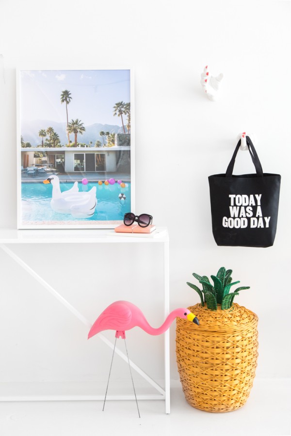 A desk with a photo on it and a bag next to it