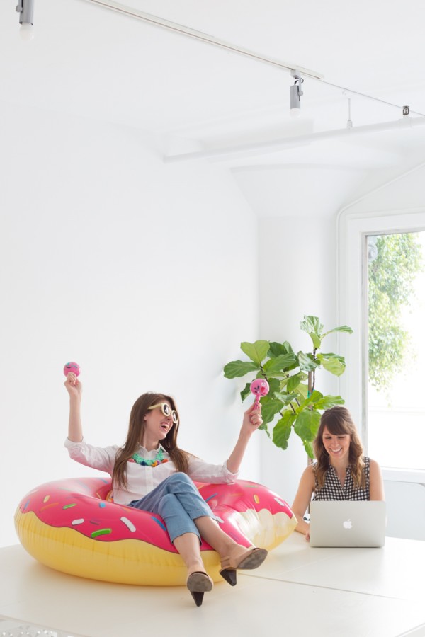 A woman sitting in a donut pool floatie