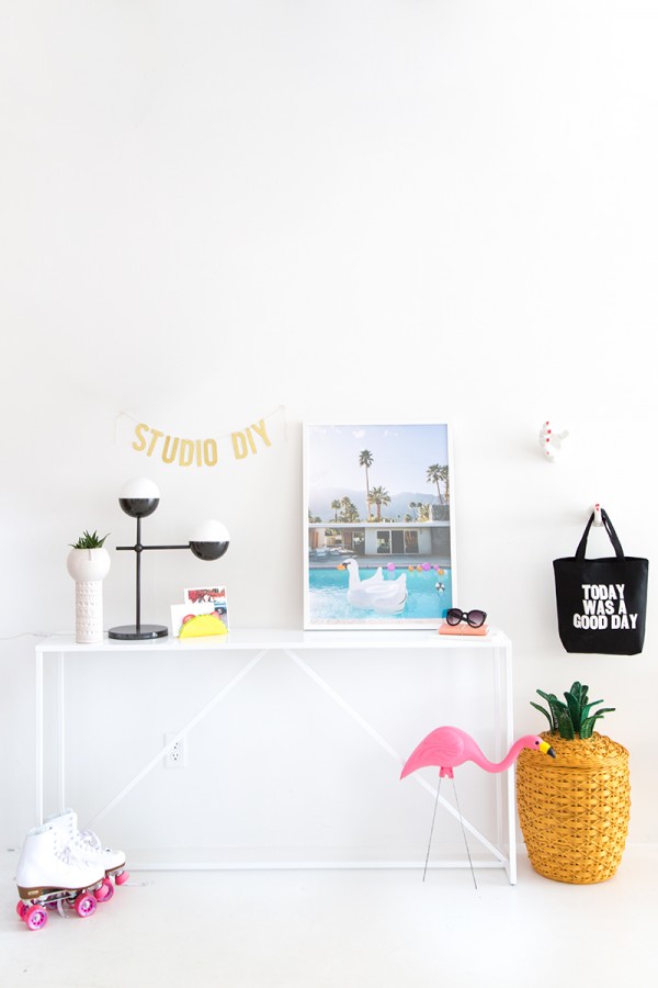 A desk with photos and bags on it