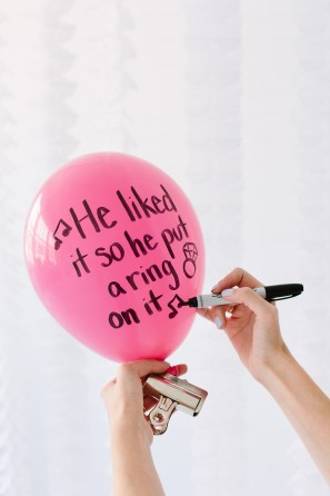 Pink balloon with words on it