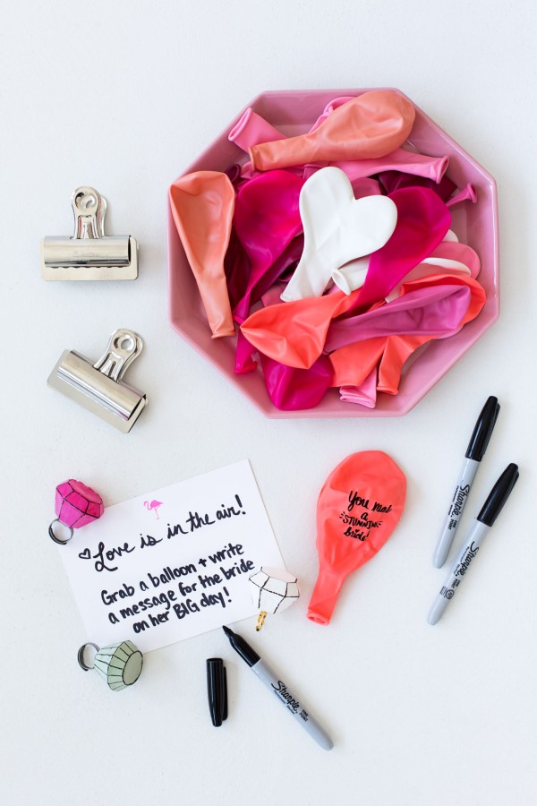 Pink balloons, cards, and sharpies