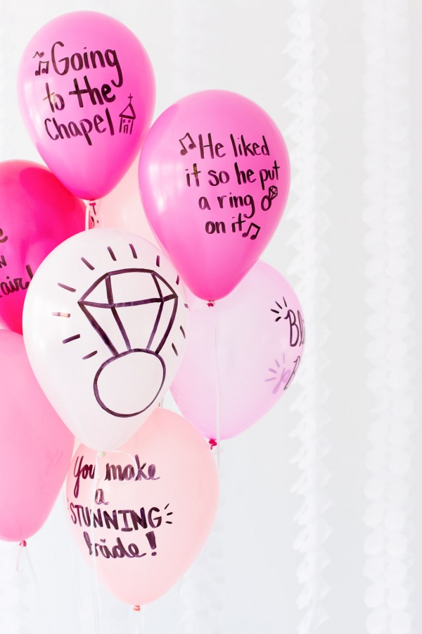 Pink balloons with words on them