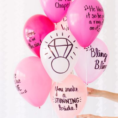 Pink balloons with words on it