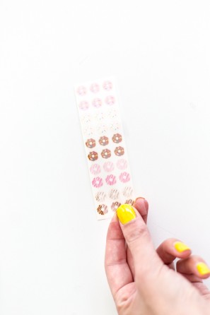 Someone holding donut stickers