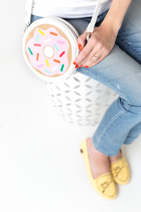 Someone holding a donut purse