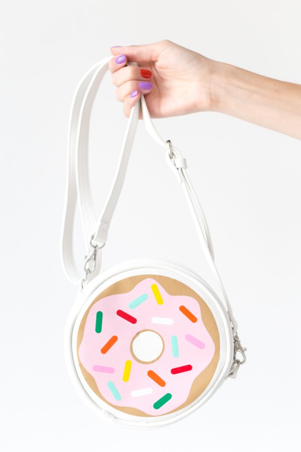 Someone holding a donut bag