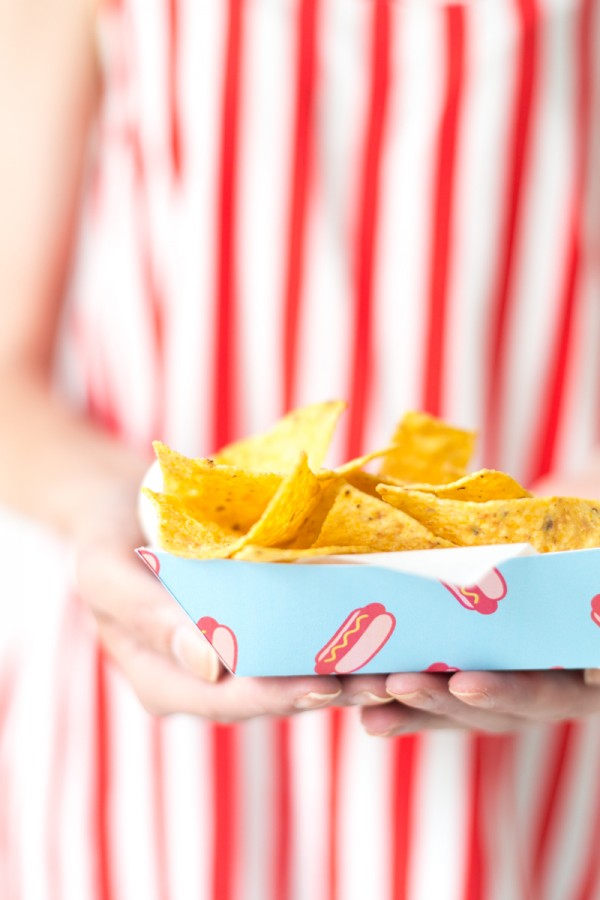 Someone holding a tray with chips in it