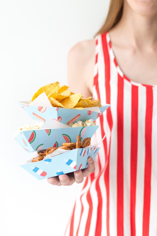 A woman holding snack trays