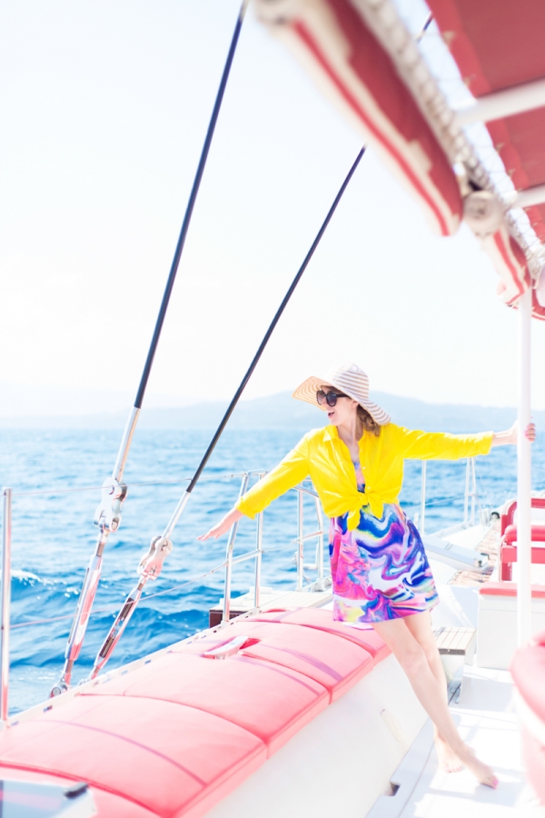 A woman wearing a yellow shirt on a boat