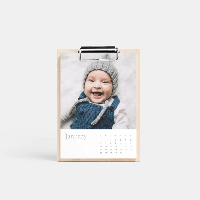 Wooden calendar with baby photo on it