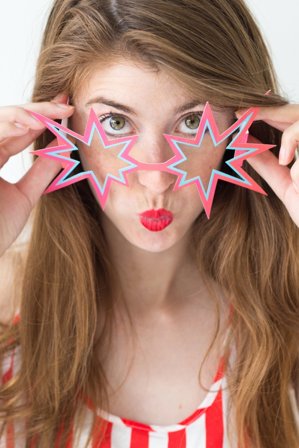 A woman with star sunglasses on