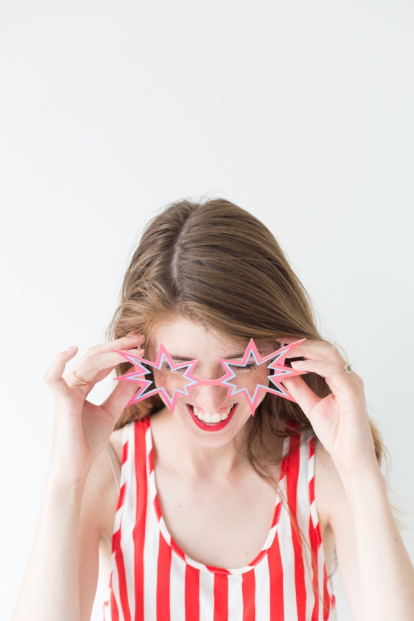 A woman wearing star sunglasses