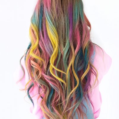 A woman with rainbow dyed hair