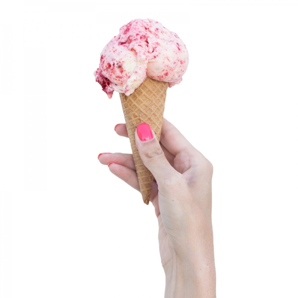 Someone holding a cone with ice cream