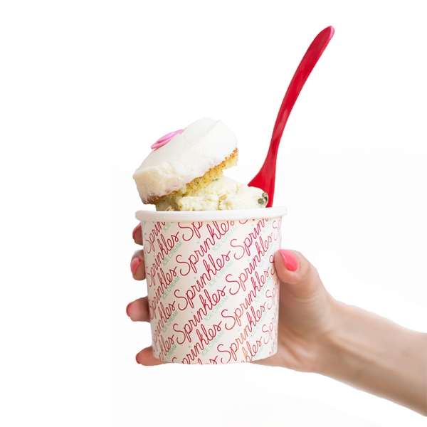 Someone holding a cup with ice cream