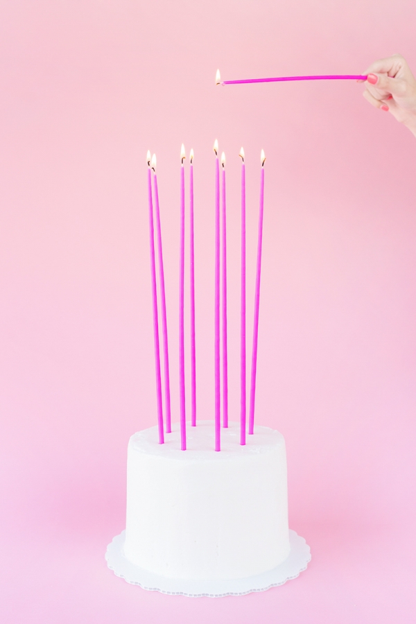 Pink candles on a cake