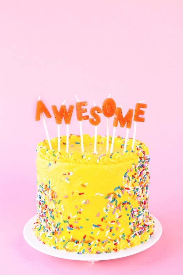 Yellow cake that says \"awesome\" on it