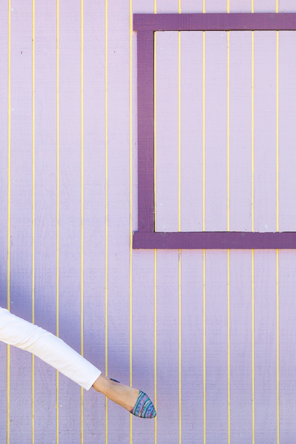 A close up of a purple and yellow wall