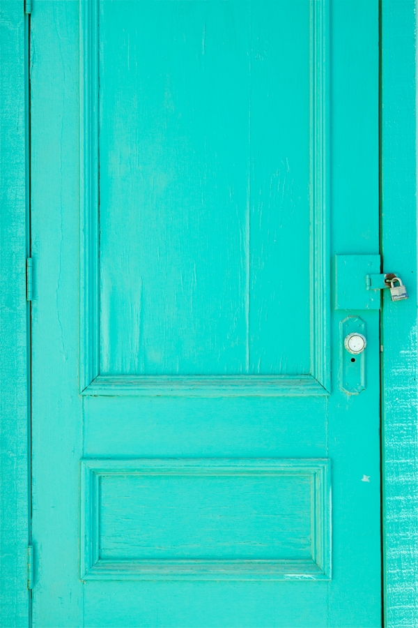 A close up of a green door