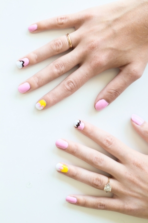 Someone with pink and yellow nails