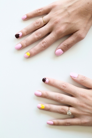 Someone with pink and yellow nails